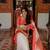 White to red ombre soft silk saree with , rich pallu, and cotton tassels. paired with a soft red woven blouse.