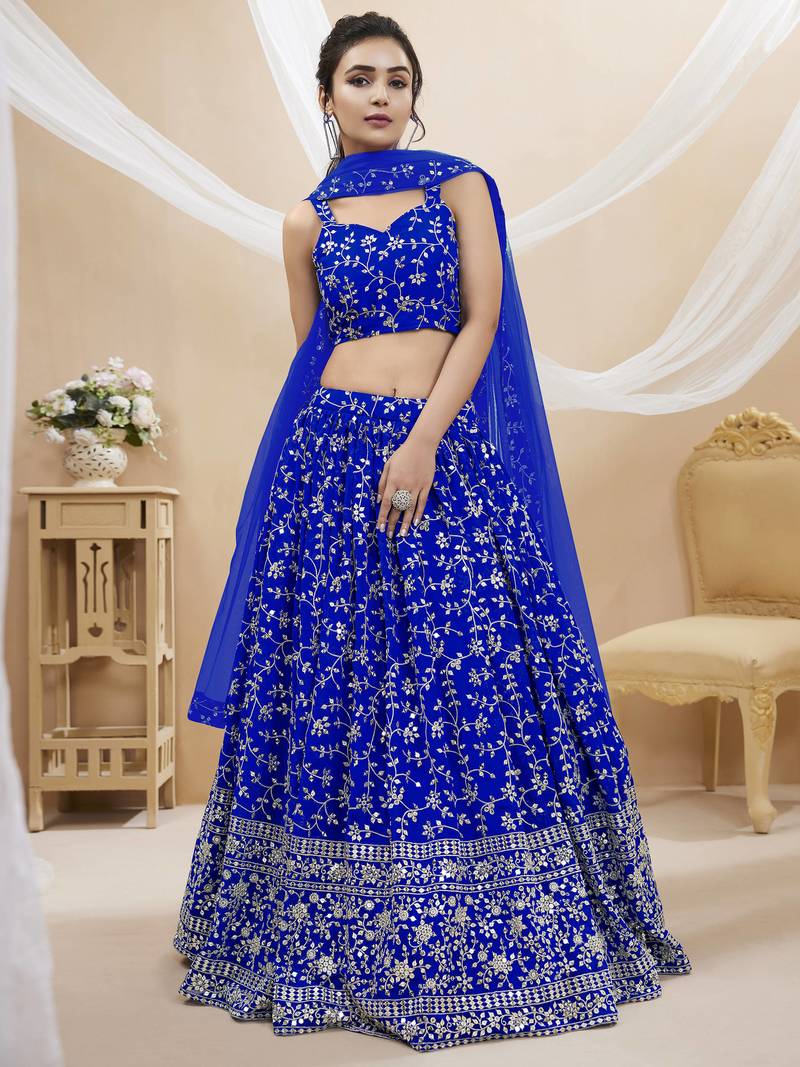 Mesmerizing Blue Sequins Georgette Wedding Wear Lehenga Choli