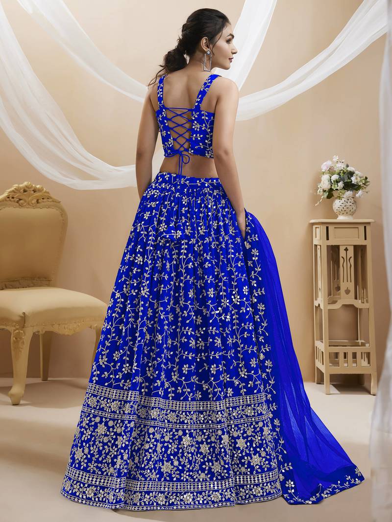 Mesmerizing Blue Sequins Georgette Wedding Wear Lehenga Choli