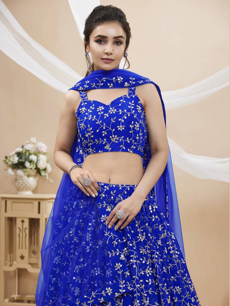 Mesmerizing Blue Sequins Georgette Wedding Wear Lehenga Choli