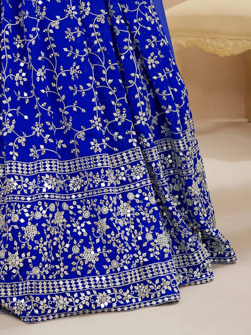 Mesmerizing Blue Sequins Georgette Wedding Wear Lehenga Choli