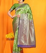 Green woven Banarasi silk blend saree with blouse
