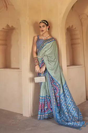 Kimisha women's green silk patola saree with unstitched blouse piece