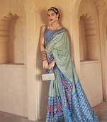 Kimisha women's green silk patola saree with unstitched blouse piece