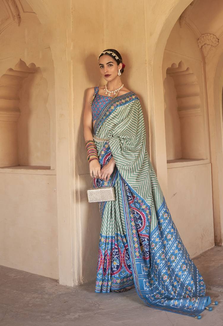 Kimisha women's green silk patola saree with unstitched blouse piece