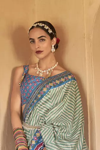 Kimisha women's green silk blend patola saree with unstitched blouse piece