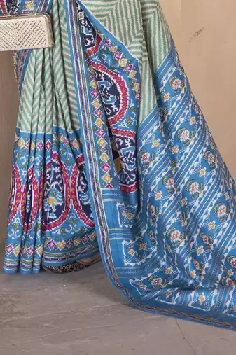 Kimisha women's green silk blend patola saree with unstitched blouse piece
