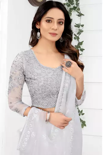White Zari Embroidered Party Wear Net Saree With Blouse Piece