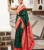 Dark green color woven silk blend saree with blouse
