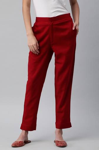 A maroon ankle length coton linen pant with plain belt in front.