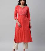 A line cotton weave kurta with delicate mirror work.