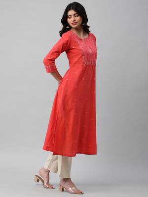 A line cotton weave kurta with delicate mirror work. 3