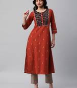 A line dobby kurta with a printed yoke highlighted with embroidery.