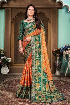 Orange and green animal printed silk saree with lace border 1