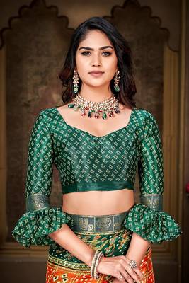 Orange and green animal printed silk saree with lace border 3