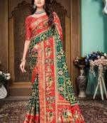 Green and red animal printed silk saree with lace border