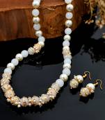 Sasha handmade pearl necklace and matching earrings set with white pearl strings and golden artwork