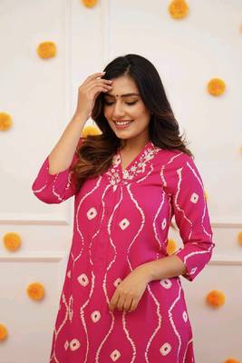 Pink colour traditional looking smart printed kurti with embroidered neck 2
