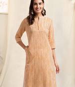 Cream orange rayon abstract lines printed pintuck buttons kurta for women