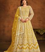 Yellow net ceremonial floor length salwar kameez