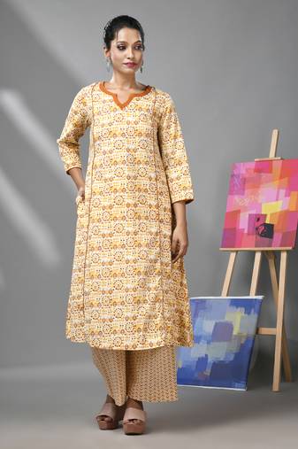 White & mustard yellow cotton kurta & palazzo set with ethnic prints