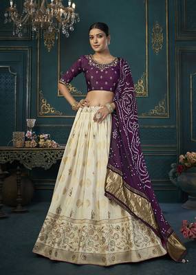 Cream color woven and embroidered dola silk lehenga choli 1