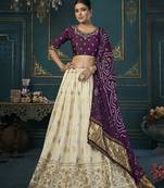 Cream color woven and embroidered dola silk lehenga choli