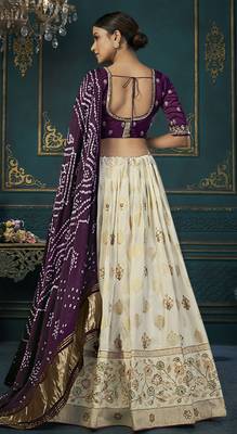 Cream color woven and embroidered dola silk lehenga choli 2