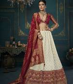 Off white color woven and embroidered dola silk lehenga choli