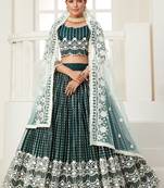 Dark-green embroidered net semi stitched lehenga