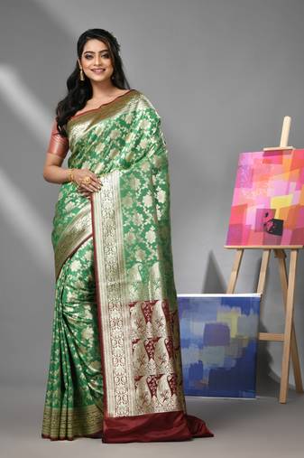 Green silk banarasi saree with zari woven designs
