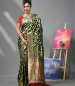 Green silk banarasi saree with zari woven floral and paisley designs