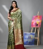 Hunter green silk banarasi saree with zari woven floral and paisley designs