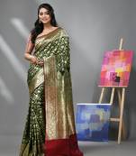 Dark green silk banarasi saree with zari woven floral and paisley designs