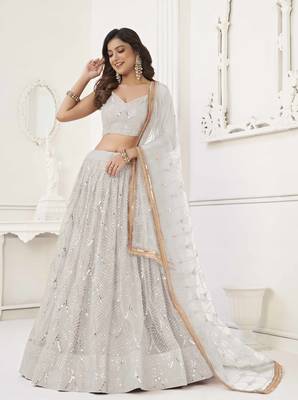 OFF WHITE  NET FABRIC LEHENGA CHOLI WITH SEQUINS AND THREAD EMBROIDERY WORK 2