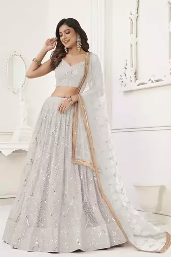 OFF WHITE  NET FABRIC LEHENGA CHOLI WITH SEQUINS AND THREAD EMBROIDERY WORK