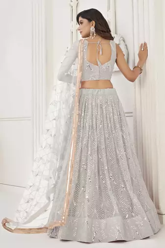 OFF WHITE  NET FABRIC LEHENGA CHOLI WITH SEQUINS AND THREAD EMBROIDERY WORK