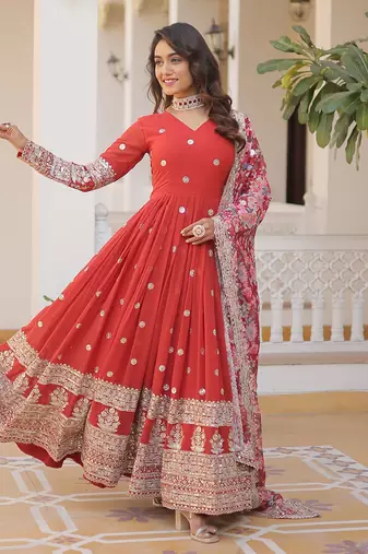 Smart and stylish orange colour heavy partywear gown with dupatta