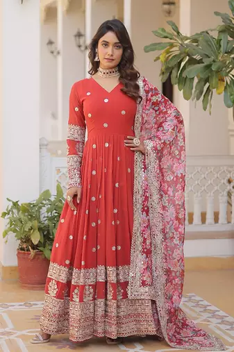 Smart and stylish orange colour heavy partywear gown with dupatta