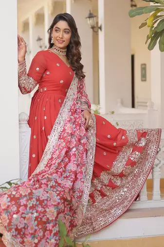 Smart and stylish orange colour heavy partywear gown with dupatta