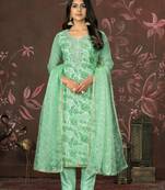 Green colour woven salwar kameez for ethnic fancy looks
