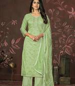 Green colour ethnic dress material for festive indian looks