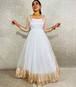 Attractive white organza  pattu with dyeing work  gown for women