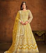 Yellow net heavy thread embroidery work salwar kameez