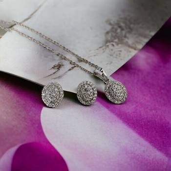 subtle rhodium locket set with filigree detailing 1