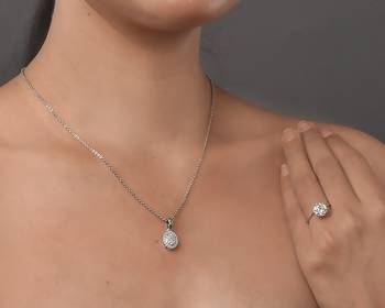 subtle rhodium locket set with filigree detailing 2