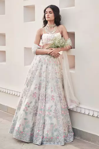 Cream Georgette Thread Embroidered Sleeveless Lehenga Choli With Net Dupatta