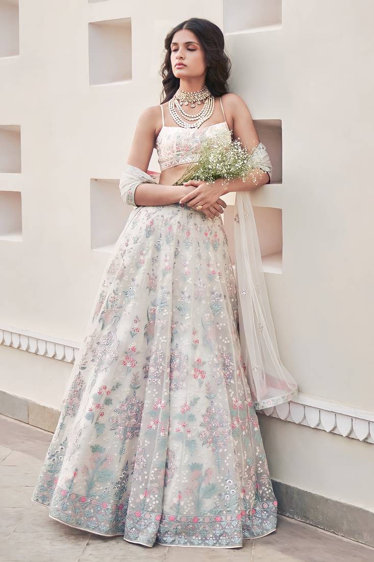 Cream Georgette Thread Embroidered Sleeveless Lehenga Choli With Net Dupatta