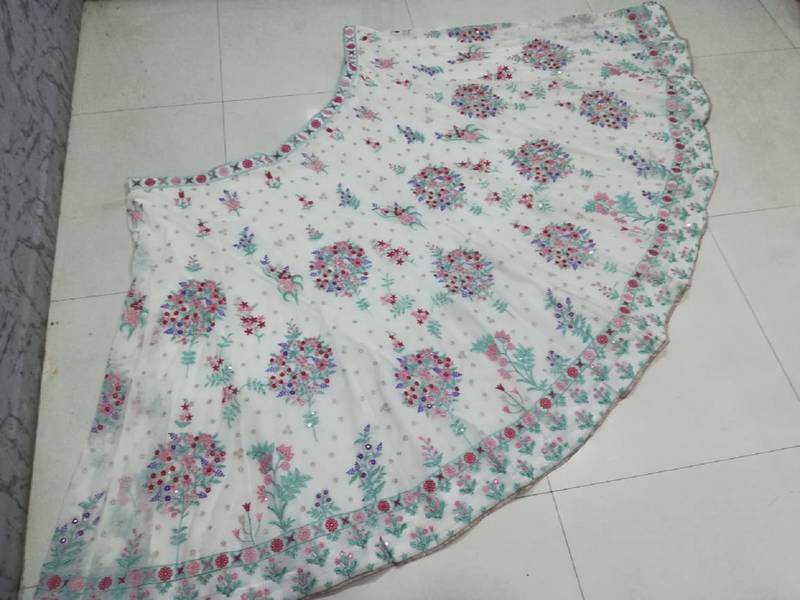 Cream Georgette Thread Embroidered Sleeveless Lehenga Choli With Net Dupatta