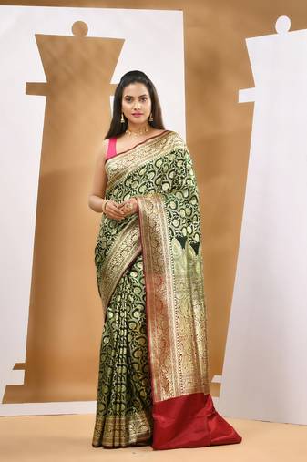 Dark green silk banarasi saree with zari woven designs